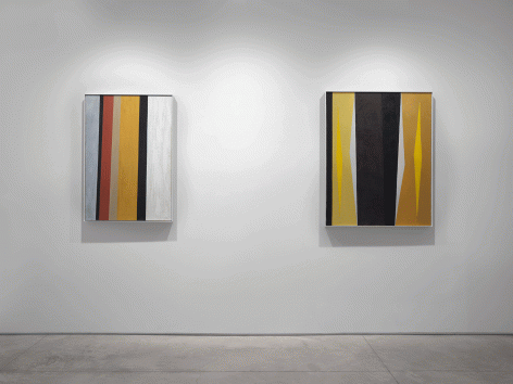 Two paintings by Alice Trumbull Mason installed in the Washburn Gallery comprised of vertical stripes in ochers, grays, blacks, whites, and reds.