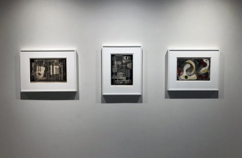 Three black and white prints by Alice Trumbull Mason in white frames installed on a white wall