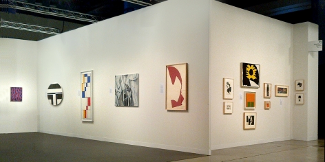 (from left) Myron Stout, Untitled, c. 1950, oil on canvasboard, 20 x 16 in., Ilya Bolotowsky, "Black and White Ellipse, 1963, oil on canvas, 30 x 40 in., Leon Polk Smith, "Diagonal Passage: Red-Blue-Yellow," 1949, oil on canvas, 54 x 20 in., Nicolas Carone, "Off the Chart," 2009, acrylic on tarpaulin, 33 x 42 in., Leon Polk Smith, Untitled, 1964, torn paper drawing, 39 x 25 in., (right wall) Small works by Nicolas Carone, Reuben Kadish, Alice Trumbull Mason, Doug Ohlson, Ray Parker, Leon Polk Smith, Richard Stankieiwcz, and Jack Youngerman